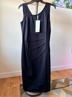 This is an elegant cocktail sheath dress in classic black Silanni.